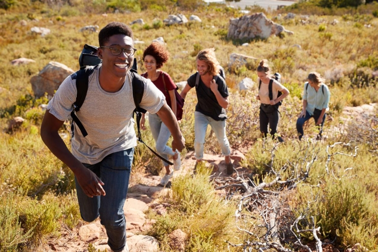 Young people walking up a hill