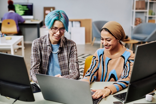 Colleagues looking at a computer