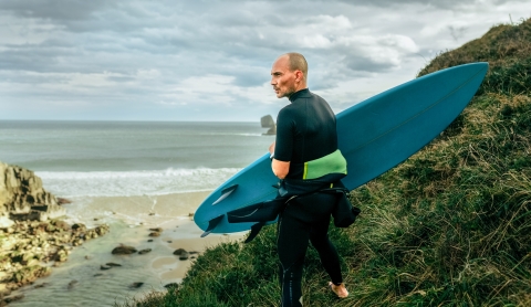 Older man going to surf