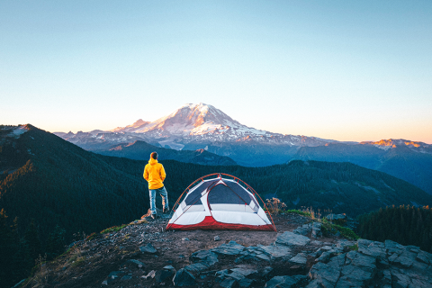 Man on mountain near Mount Rainier, Washington