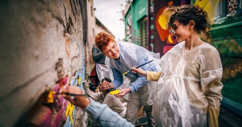 Volunteers painting a wall